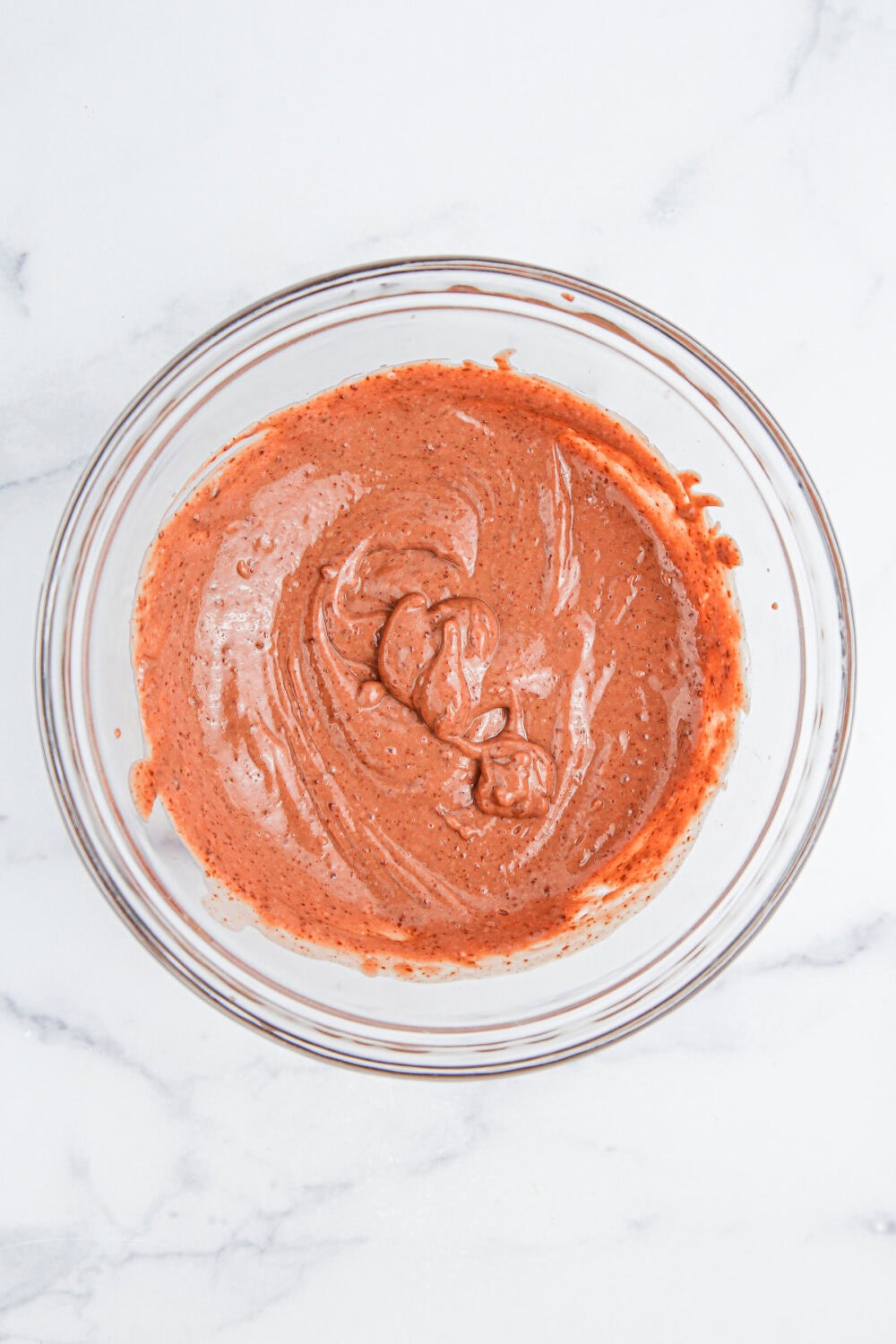 Chocolate pudding mix in a mixing bowl. 