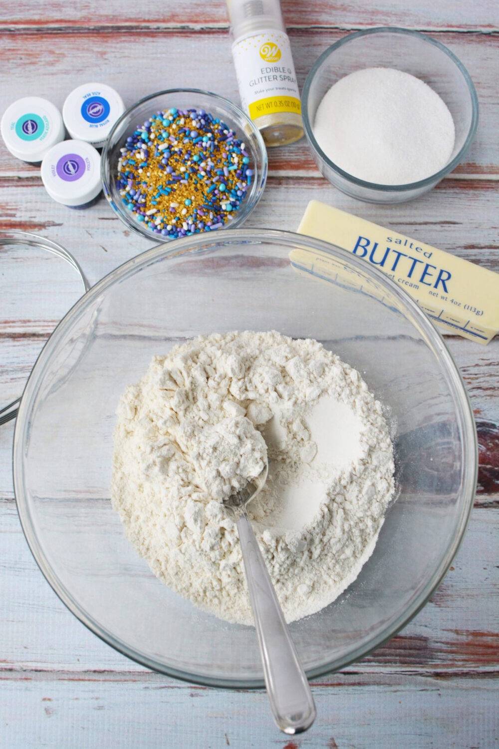 Flour, sprinkles, food coloring, edible glitter, butter, and sugar.