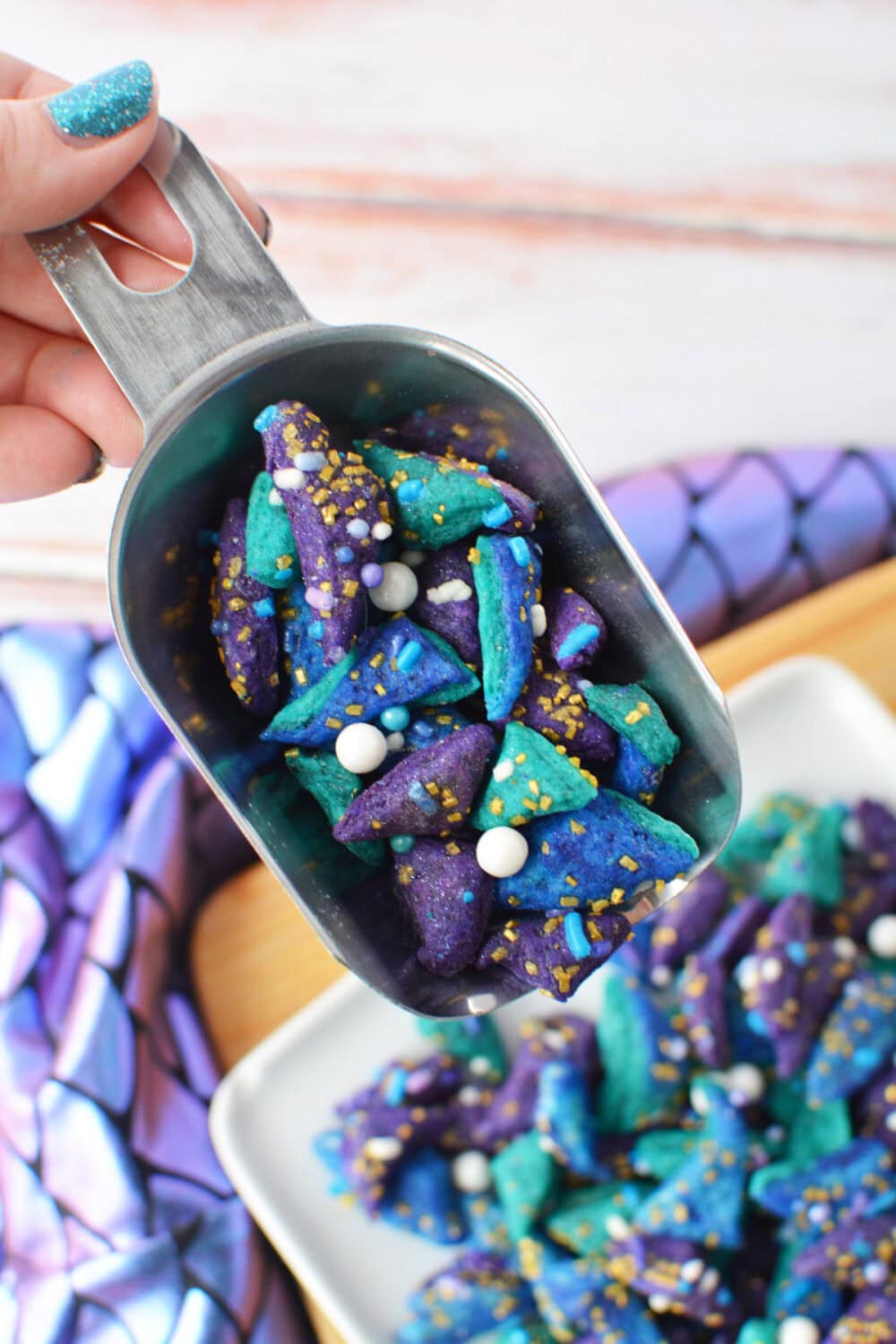 Shovel full of mini mermaid cookies.
