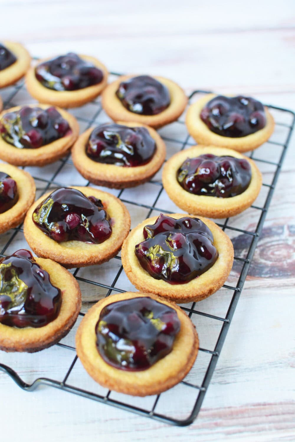 Blueberry pie cookies on a wire rack. 