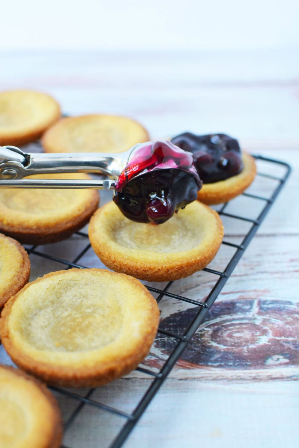 Adding blueberry pie filling to sugar cookie crusts. 