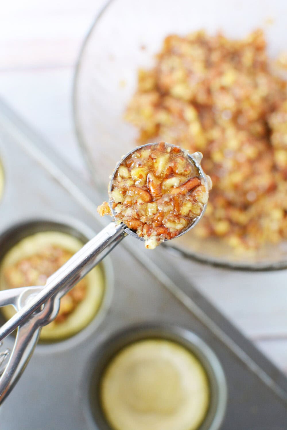 Cookie scoop with pecan pie mixture in it. 