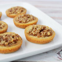 Pecan pie cookies on a white plate.