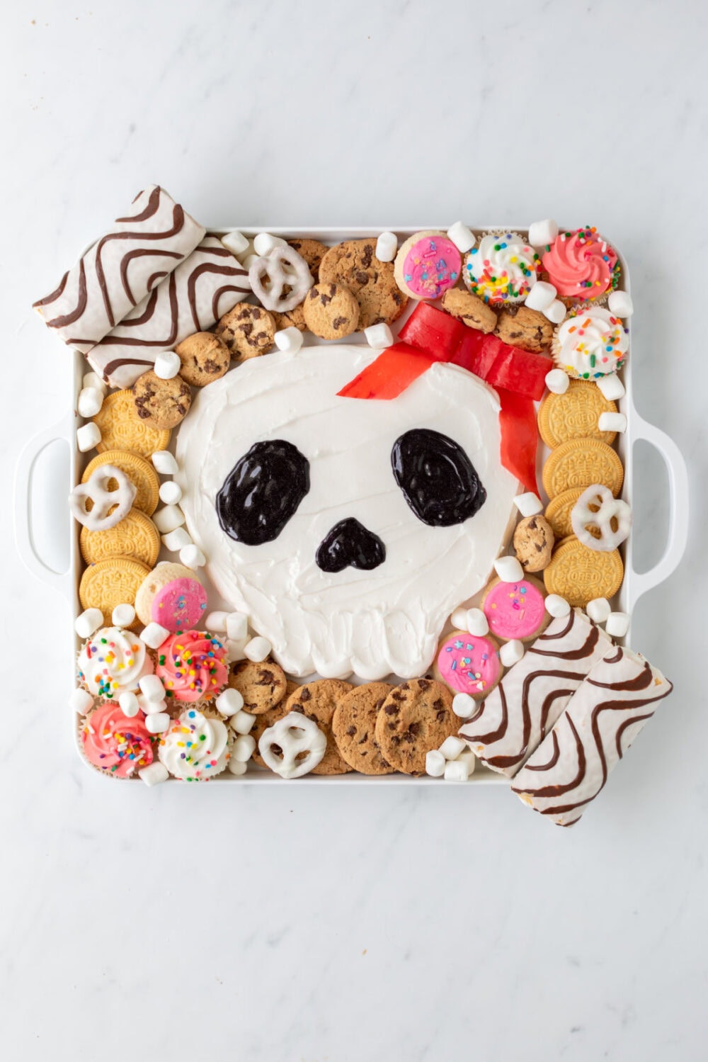 Adding pretzels and other sweets to fill in spaces. 
