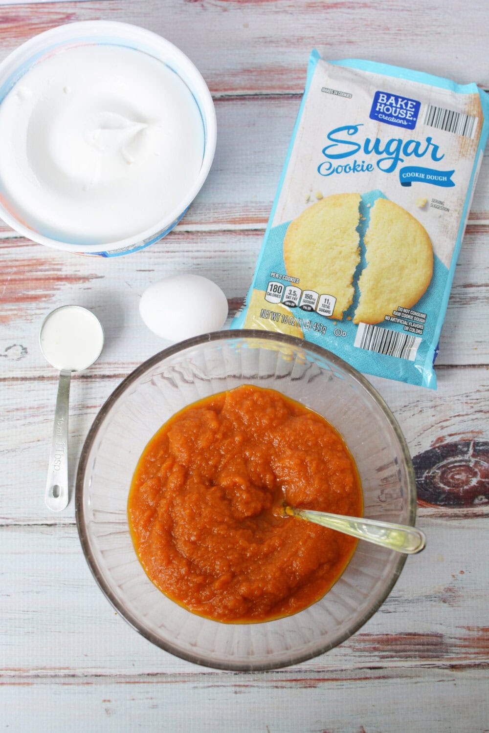 Break and bake sugar cookie dough, egg, whipped topping, heavy cream, and pumpkin pie filling. 