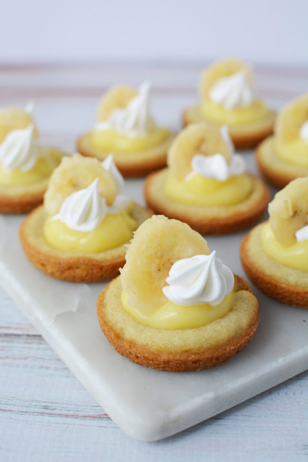 Banana cream pie cookies on a board. 