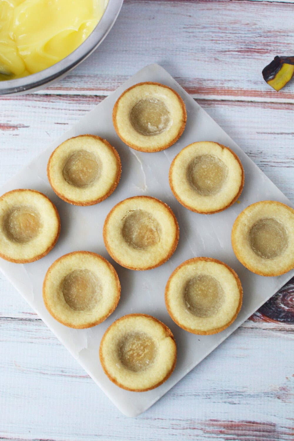 Baked sugar cookie crusts waiting for filling. 