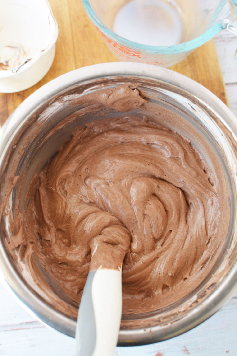 Mixing chocolate mousse filling. 