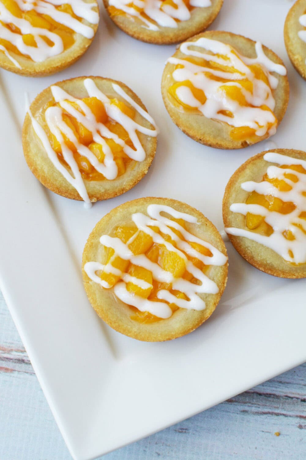 Peach pie sugar cookies with icing on top.