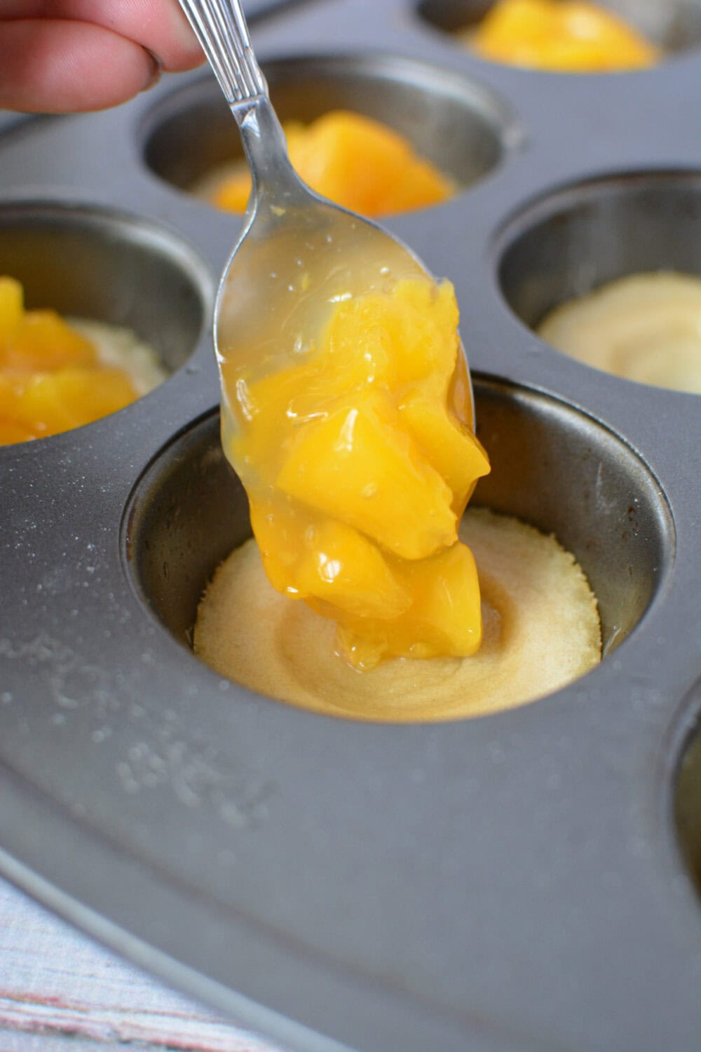 Peach pie filling going into cookie crusts.