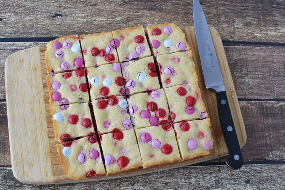 Cookie bars sliced on a cutting board. 
