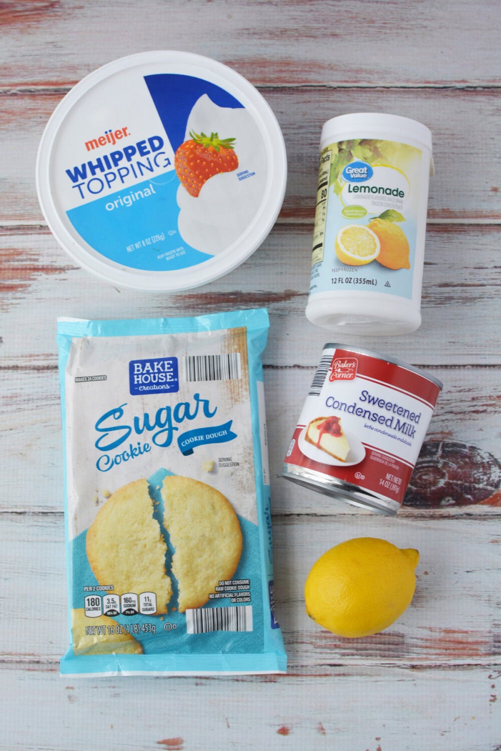 Whipped topping, sugar cookie dough, lemonade, sweetened condensed milk, and lemon. 