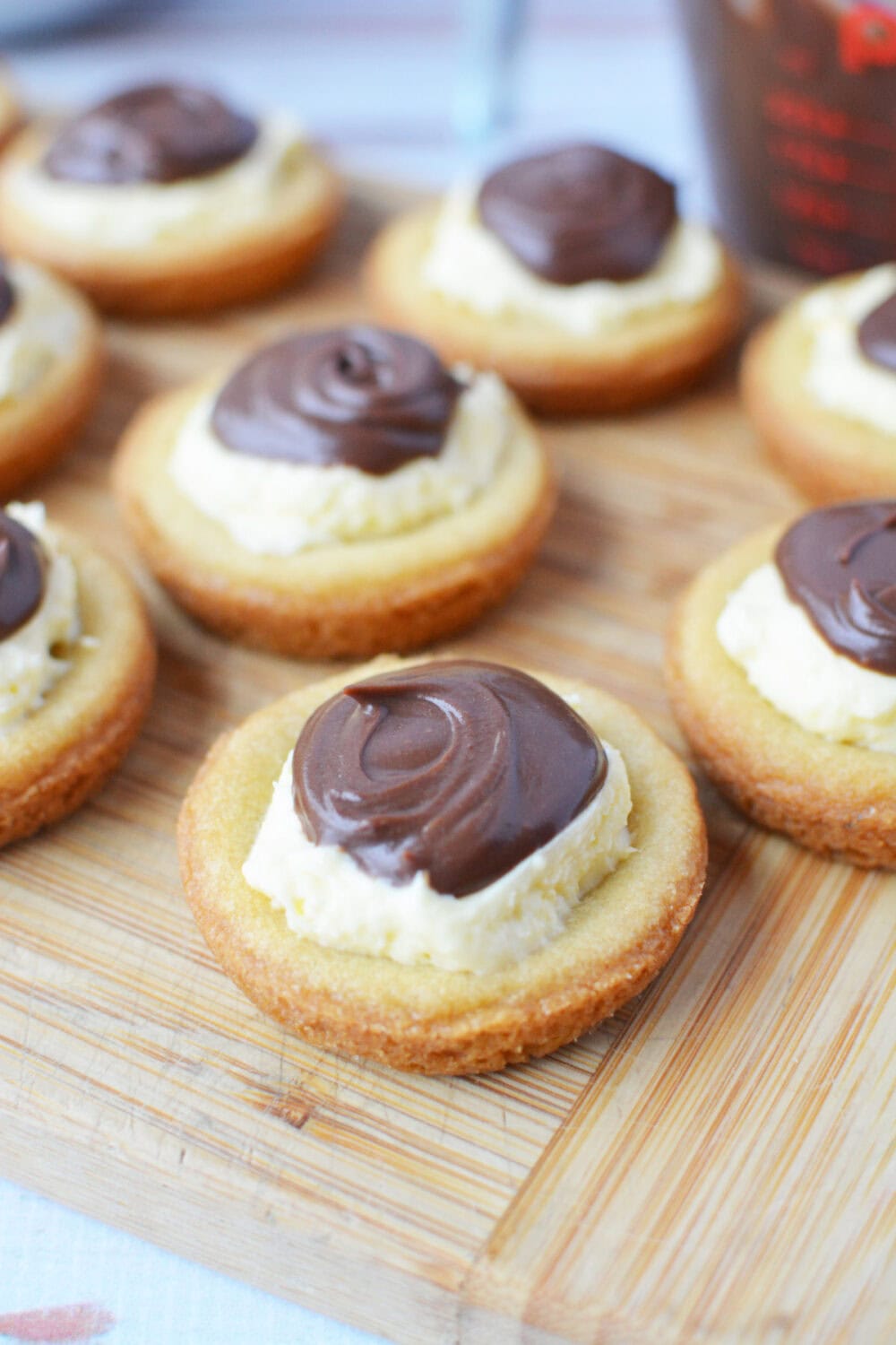 Boston cream pie cookies topped with chocolate ganache.