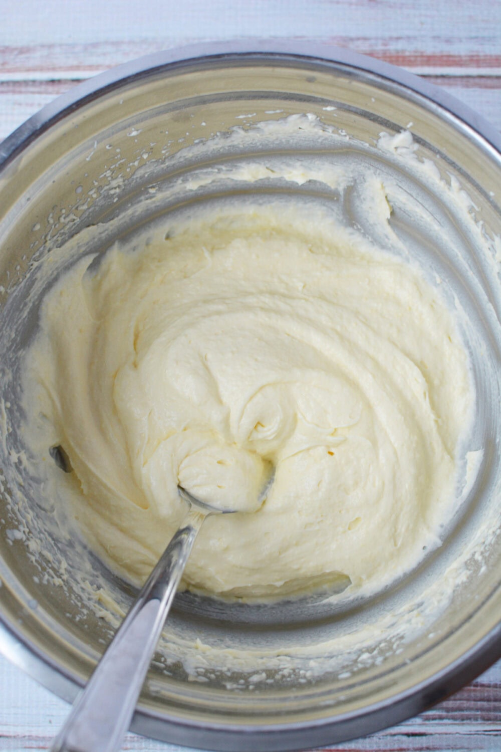 Mixing custard pudding mixture in a mixing bow.