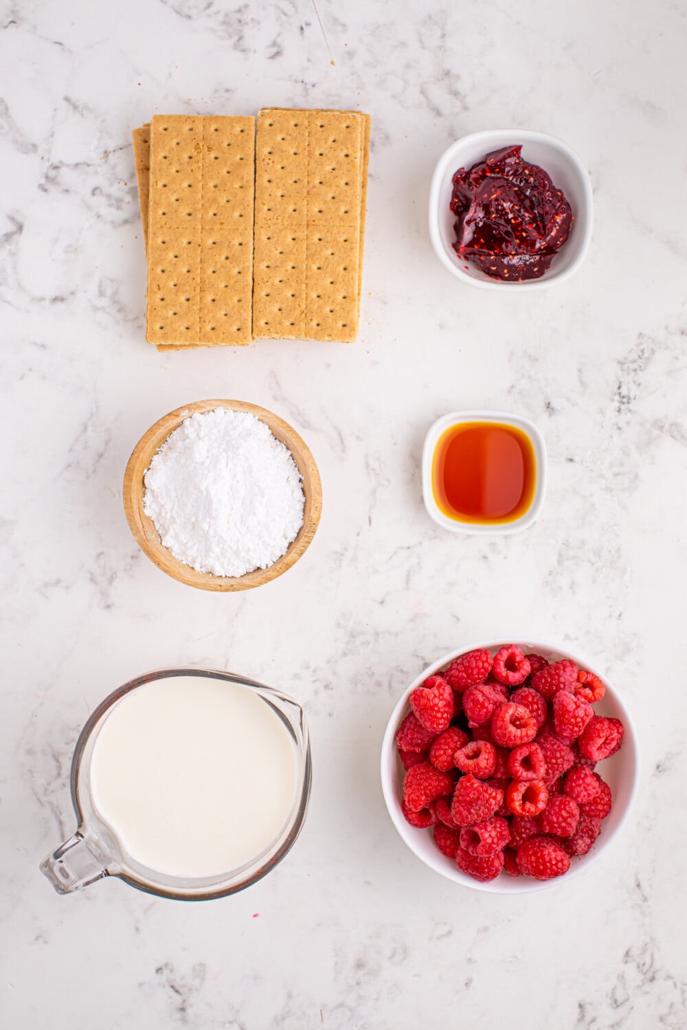 Graham crackers, raspberries, powdered sugar, heavy cream, and raspberry jam.