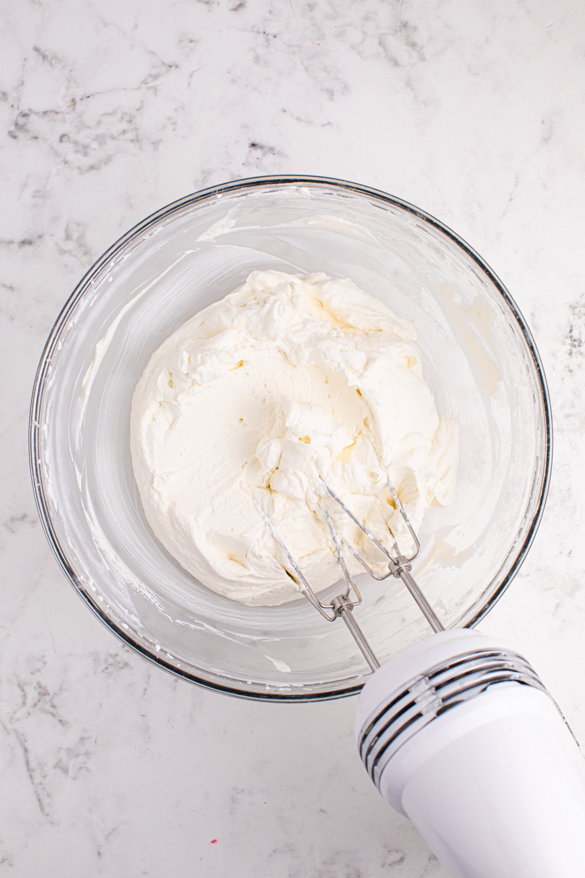 Whipping heavy whipping cream.
