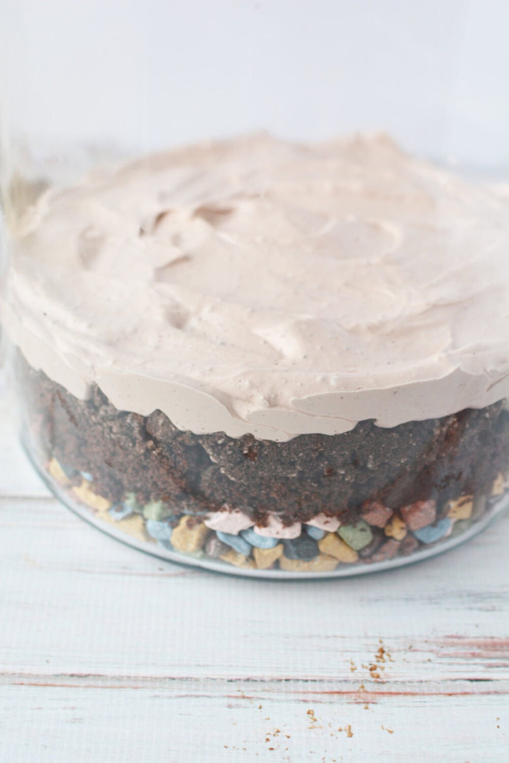 Layers of candy stones, cake, and mousse