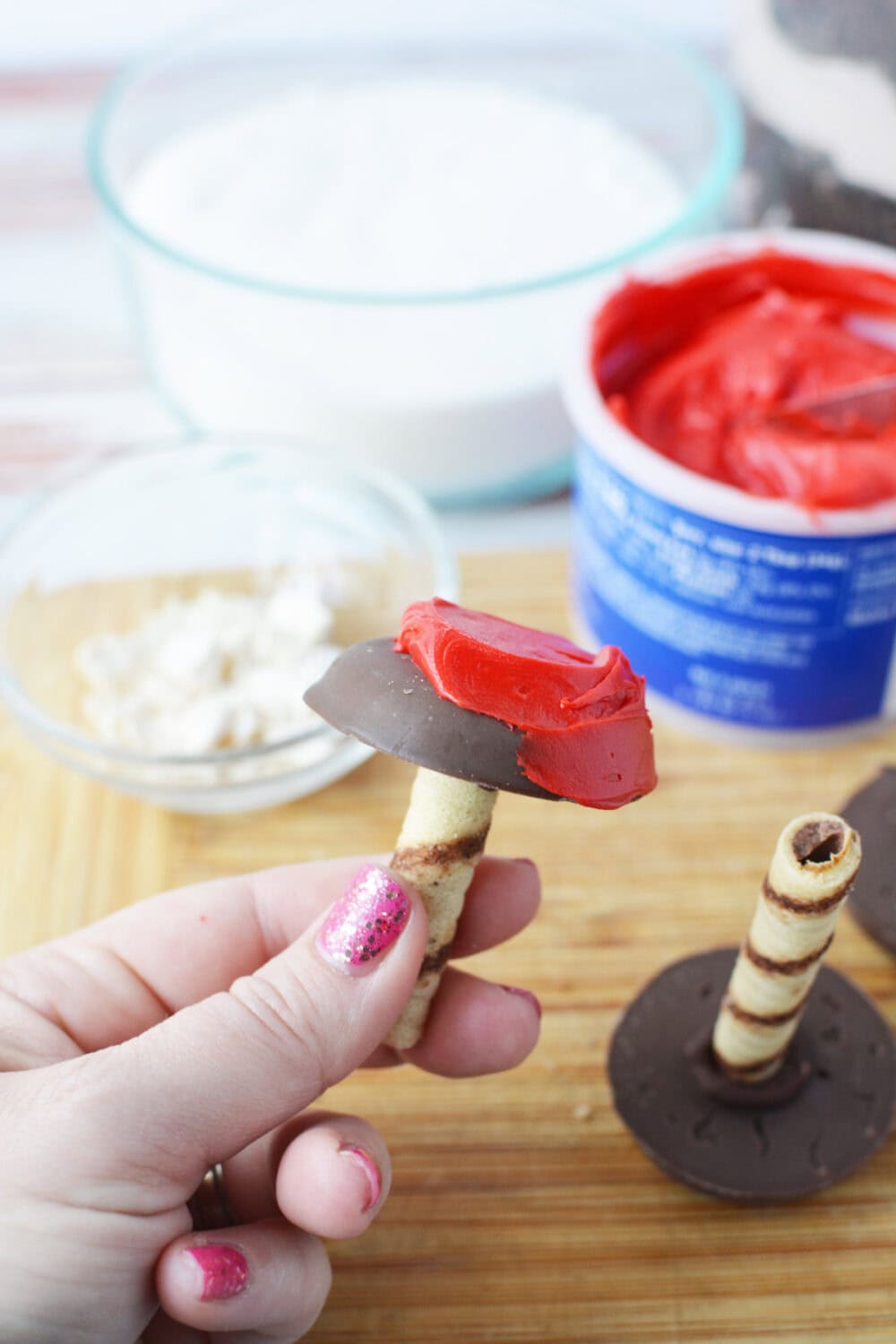 Red frosting on top of a cookie