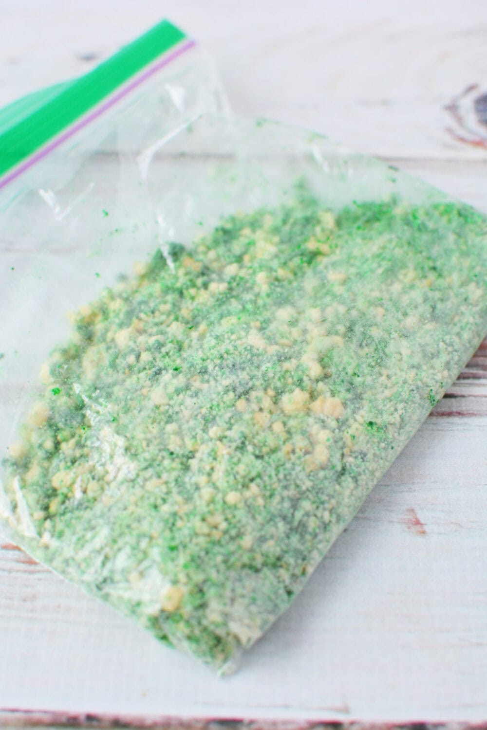 a bag of green food-colored cookie crumbles