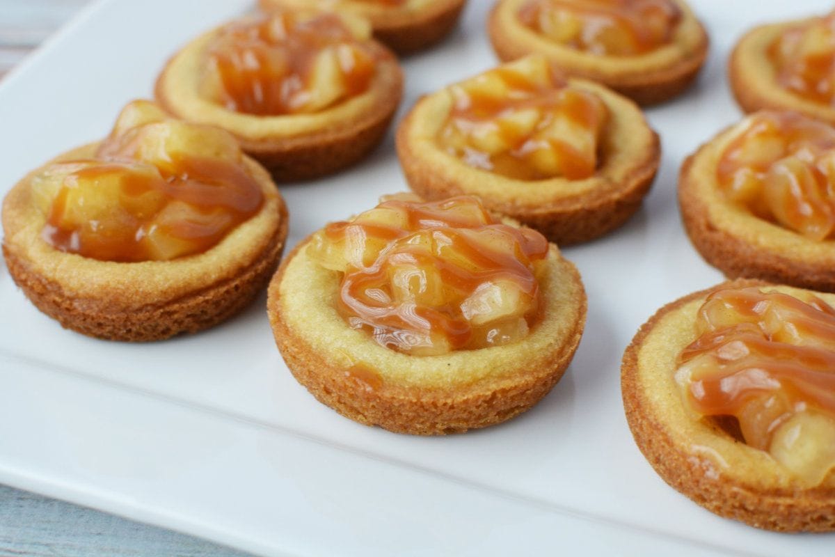 Apple pie cookies topped with caramel sauce.