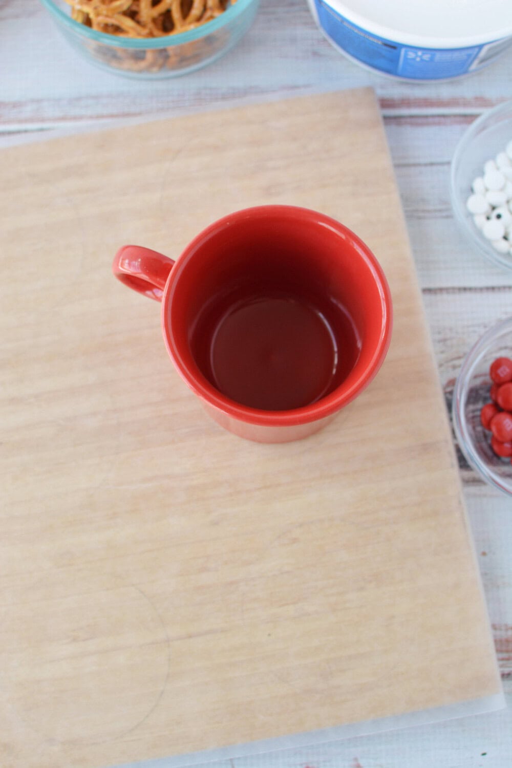 Red mug on parchment paper