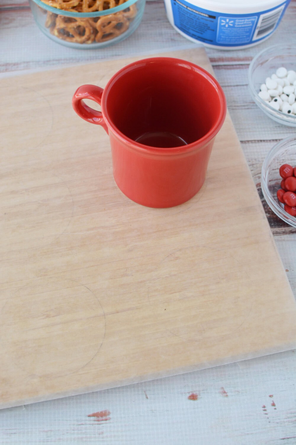 Red mug on parchment paper