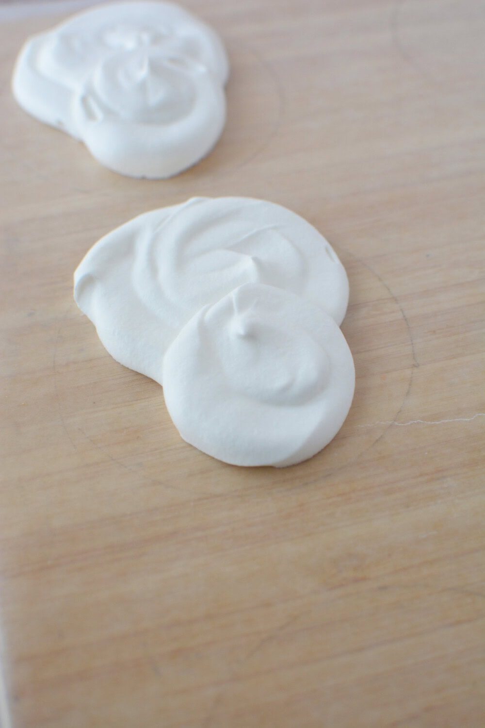Piping head and snout onto parchment paper