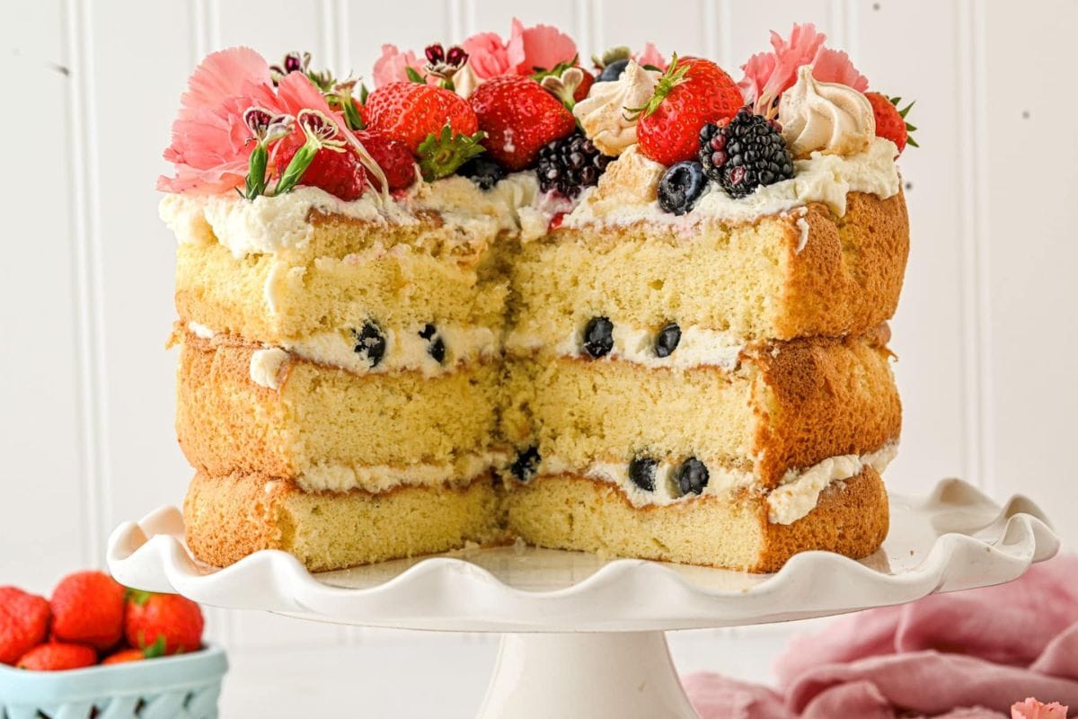Eton mess cake with a slice taken out