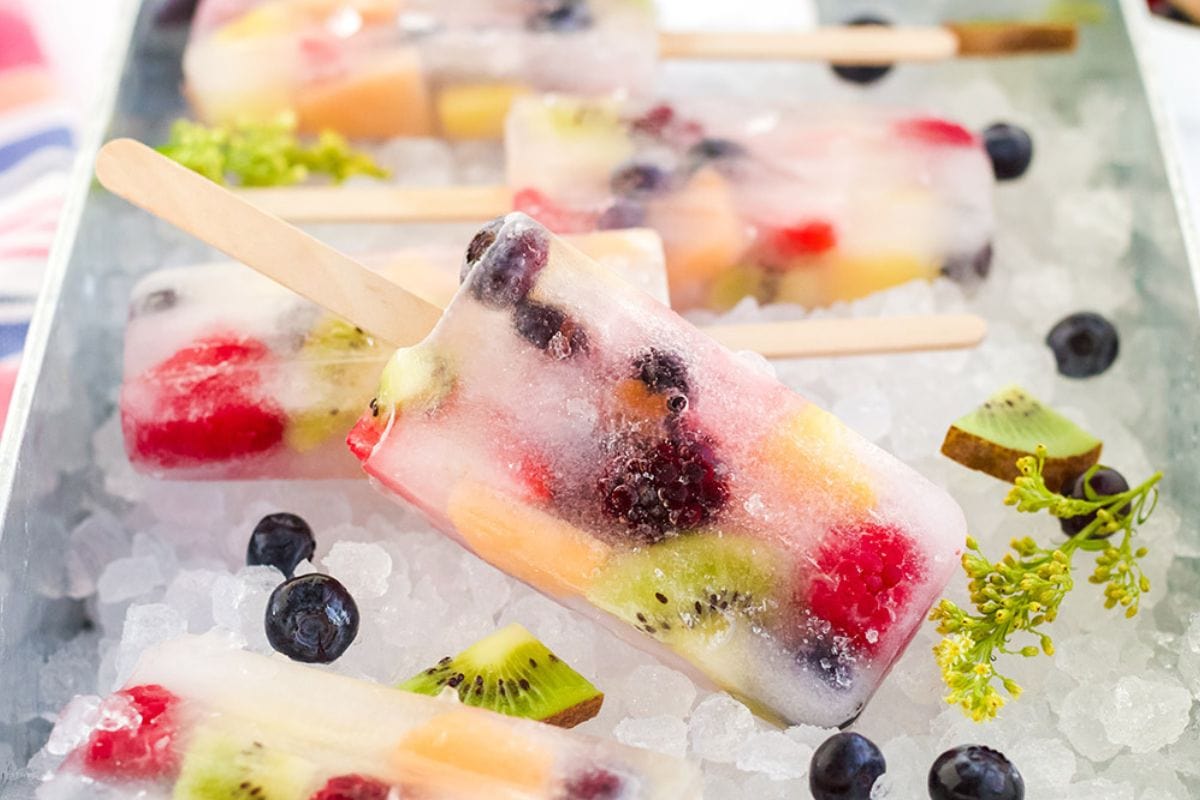 fresh fruit in clear juice frozen into popsicles