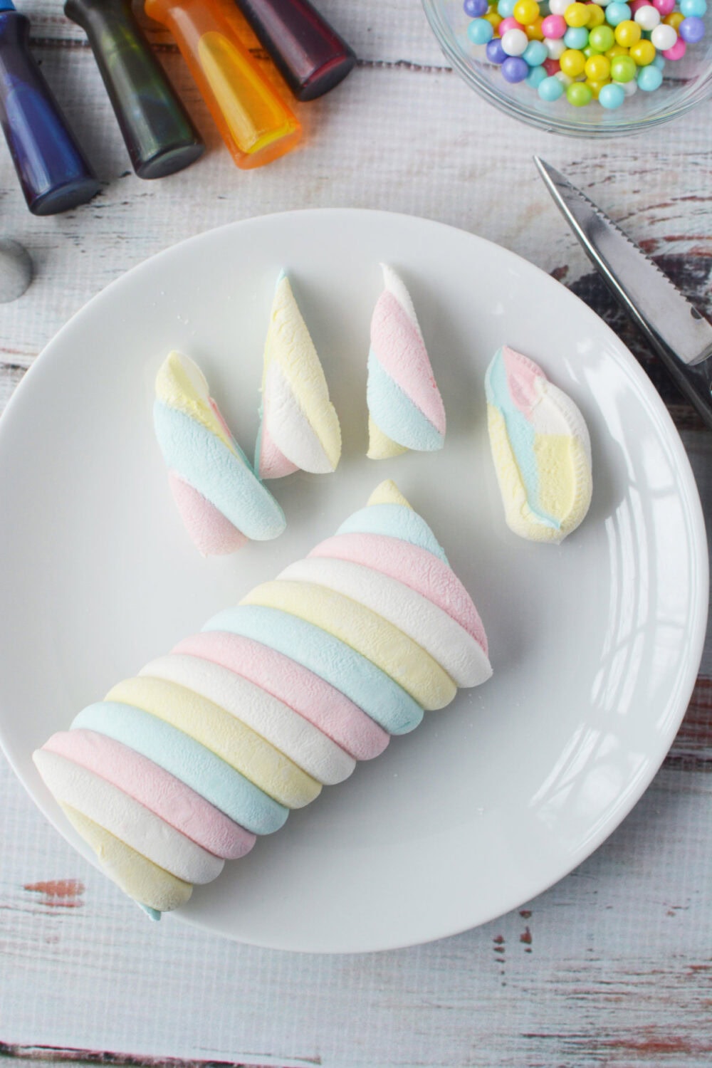 Rainbow marshmallow cut into unicorn horns