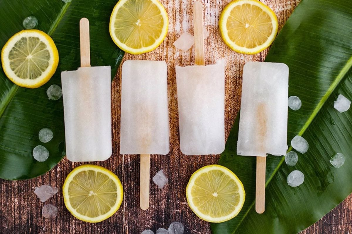 lemon popsicles lined up on a table