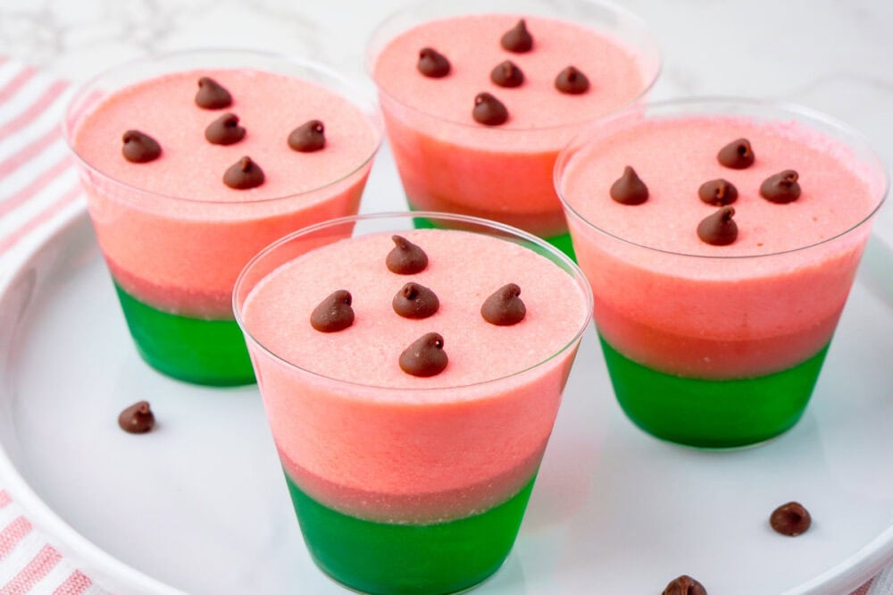 4 watermelon jello cups on a tray